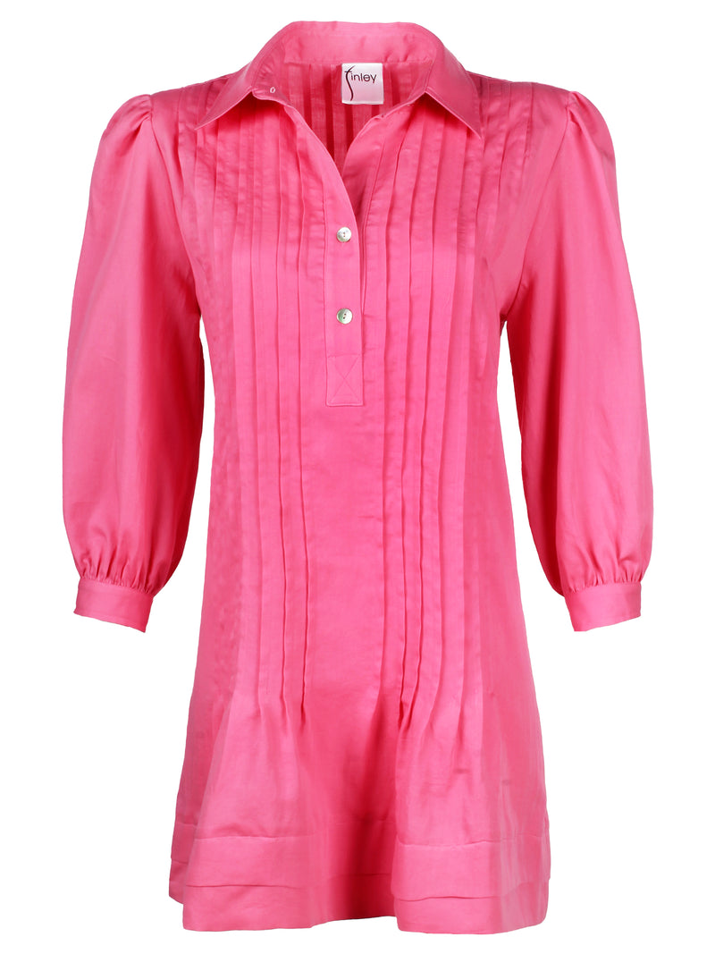 A front view of the Finley Belinda dress, a hot pink tucked dress with a relaxed shape, spread collar, and bracelet sleeves.