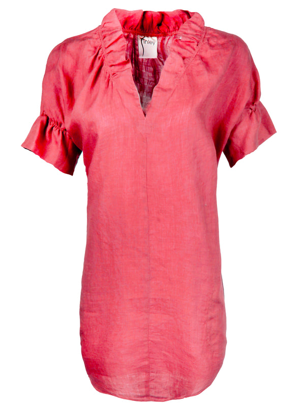 A front view of the Finley Crosby shirt dress, a washed linen dress with ruffled sleeves and collar and a pink hibiscus color.