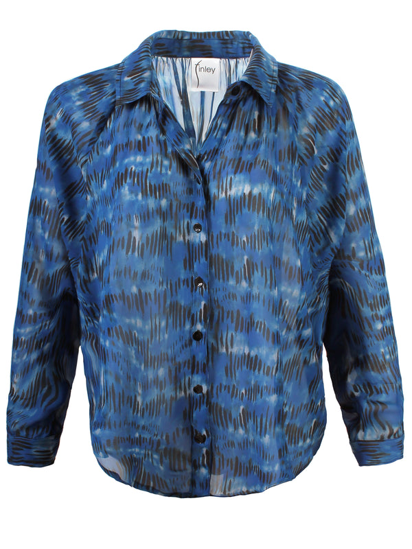 A front view of the Finley Dylan Dolman shirt, a chiffon blouse with a relaxed fit and an abstract blue and black pattern.