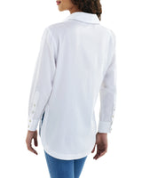 A fashion model wearing the Finley boyfriend shirt, a white cotton voile button-down blouse with a relaxed fit.