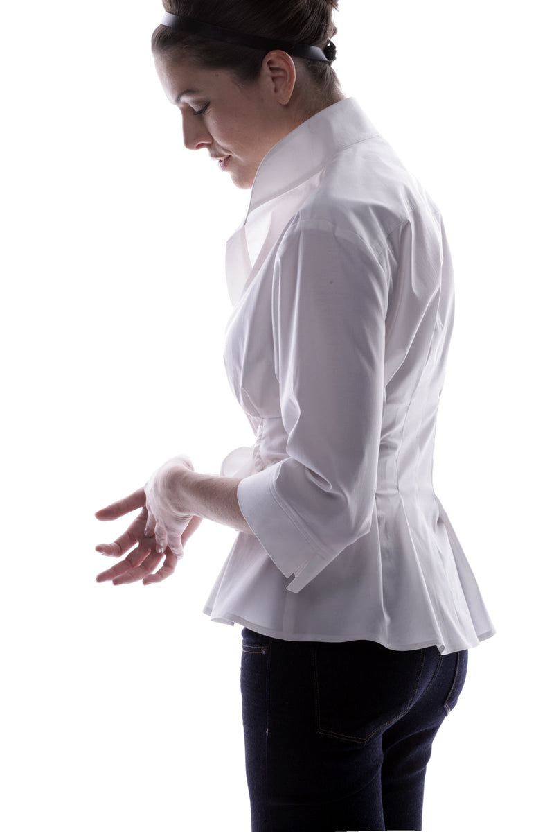 The Finley Rocky blouse, a pale blue button down weathercloth blouse with a fitted shape, a tie front, and stand collar.