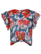 The Finley Rosie blouse, a cotton voile front-tie pullover blouse with short flutter sleeves and a red and blue floral print.