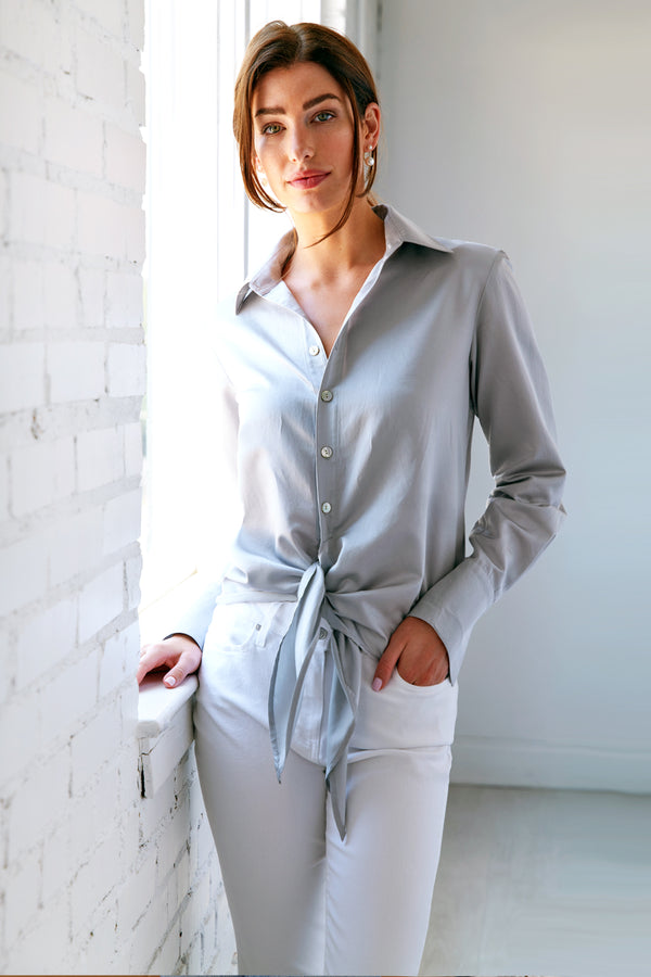 The Finley Lindy blouse, a silver button up front-tie silk/cotton shirt with a semi-fitted shape a faux French cuff.