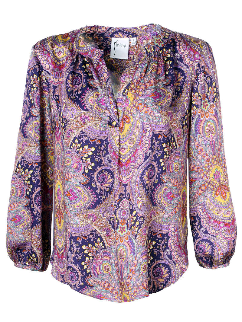 A front view of the Finley Stephanie top, a popover blouse with a relaxed fit, long sleeves, and a purple paisley pattern.