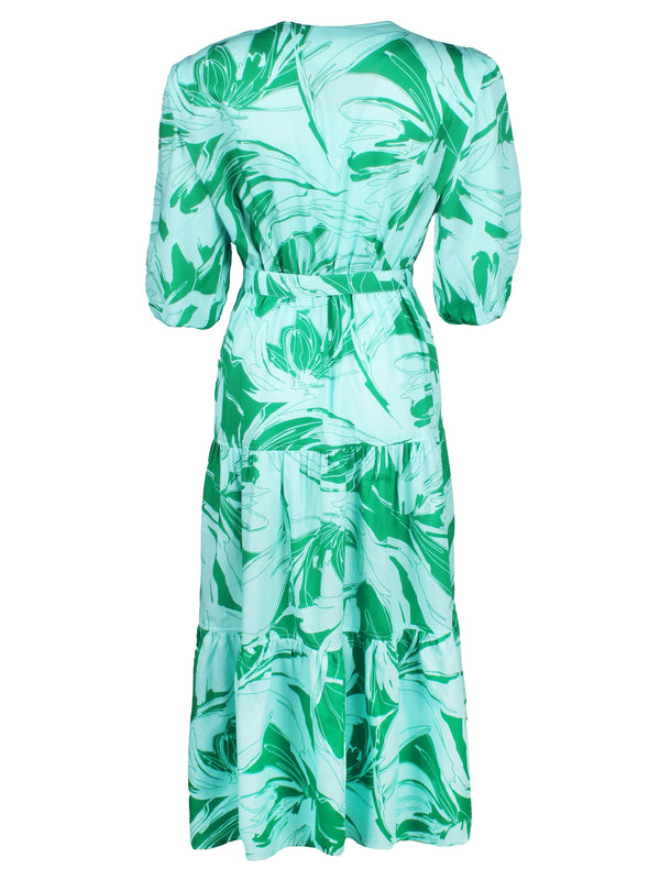 A front view of the Finley Aerin dress, a long cotton dress with a self belt and a green and white floral palm pattern.