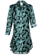 The Finley Agatha dress, a cotton voile button down midi shirt dress with a ruffle hem and a teal and black floral pattern.