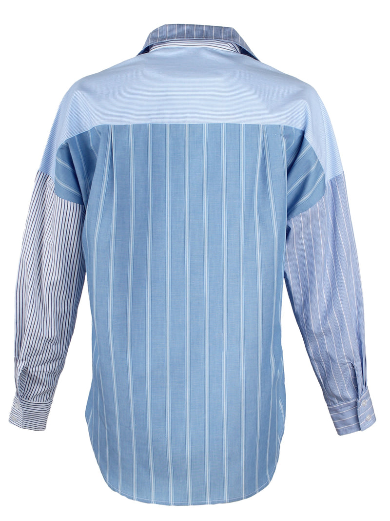 The Finley boyfriend shirt, a color-blocked blue and white striped shirt with an asymmetric pocket.
