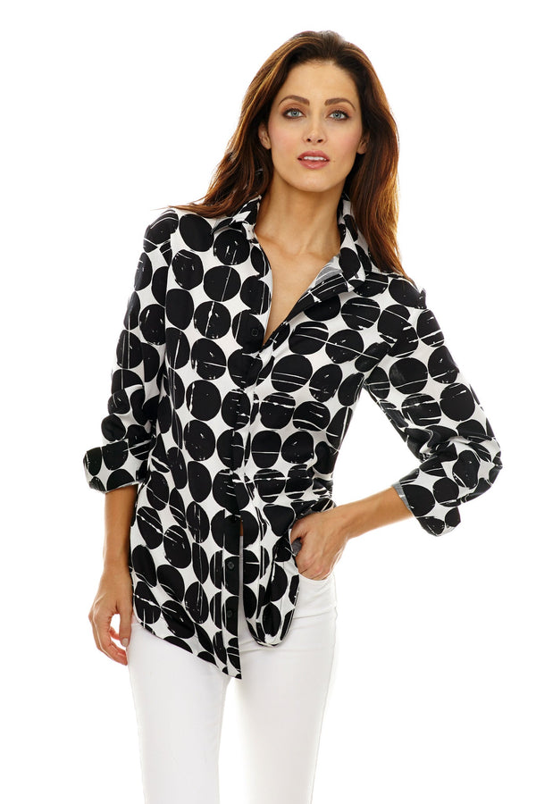 A fashion model wearing the Finley boyfriend shirt, a button-down blouse with a relaxed shape and a black and white geometric pattern.
