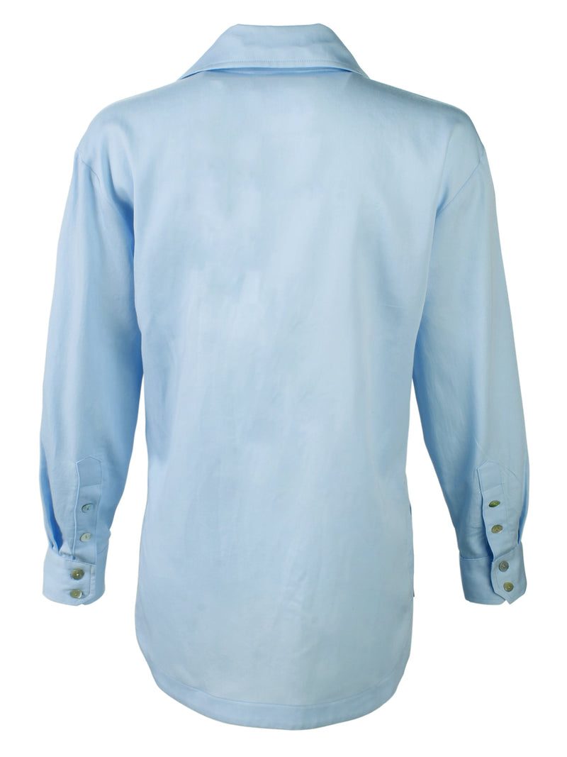 A rear view of the Finley boyfriend shirt, a white cotton voile button-down blouse with a relaxed fit.