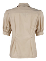 The Finley camp shirt, a white button down weathercloth blouse with chest pockets, short puff sleeves, and a relaxed fit.
