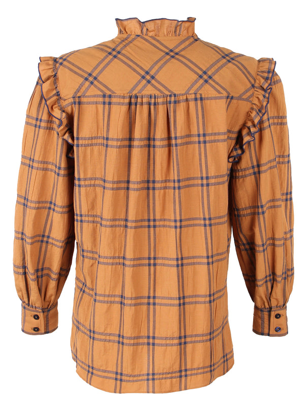 A front view of the Finley Byrdee blouse, a long sleeve button down top with ruffle trim and an orange and black plaid print.