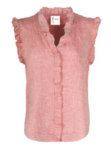 The Finley Byrdee blouse, a sleeveless washed linen button-down blouse with ruffle detailing and a peach pink color.