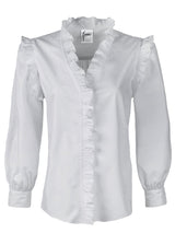A front view of the Finley Byrdee blouse, a long sleeve white poplin top with ruffled trim, tonal piping, and a v neckline.
