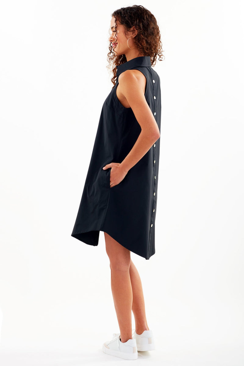 The Finley swing dress, a casual cotton button-down sleeveless black midi shirt dress.