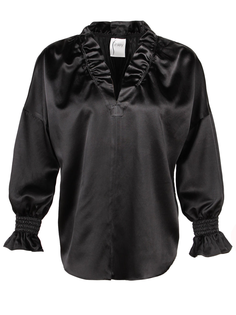 The Finley Crosby shirt, a cotton/silk black long sleeve popover blouse with ruffle collar, ruffle sleeves, and a v-neck.
