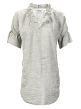 Front view of the Finley Crosby, a casual washed linen natural gray shirt dress with pockets and ruffled sleeves and collar.