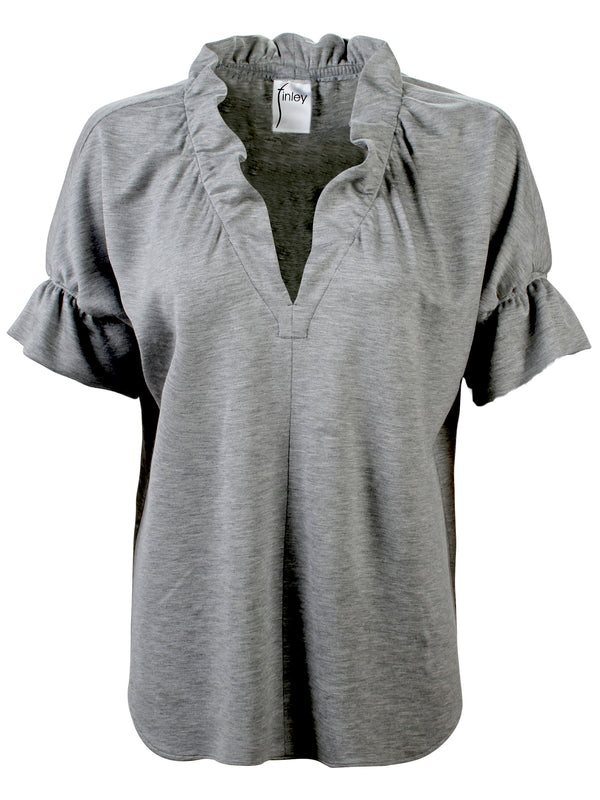 A front view of the Finley Crosby top, a casual blouse with ruffled collar and sleeves in grey melange knit.