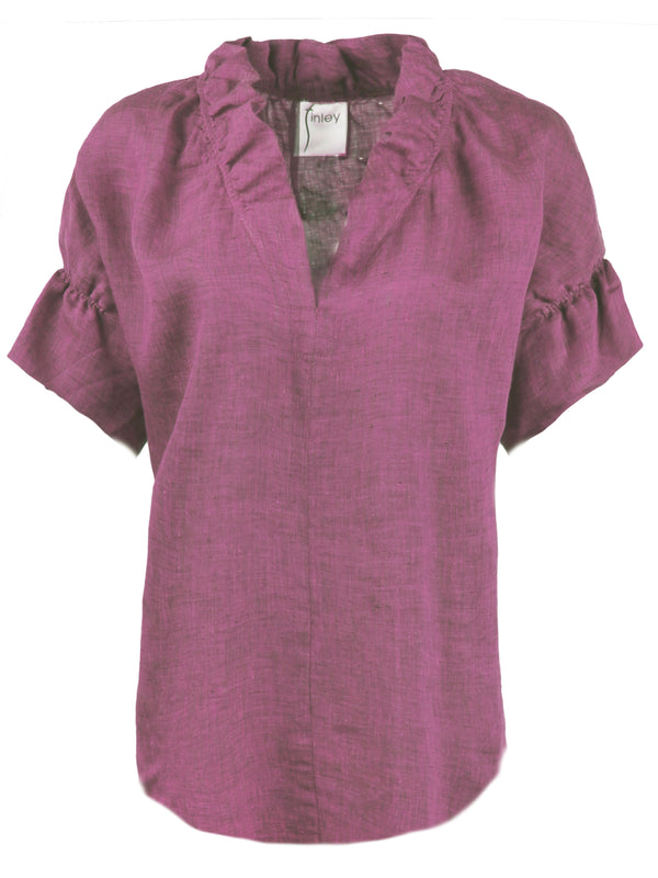 The Finley Crosby blouse, a short sleeve washed linen purple popover blouse with ruffle detail on the collar and sleeves.