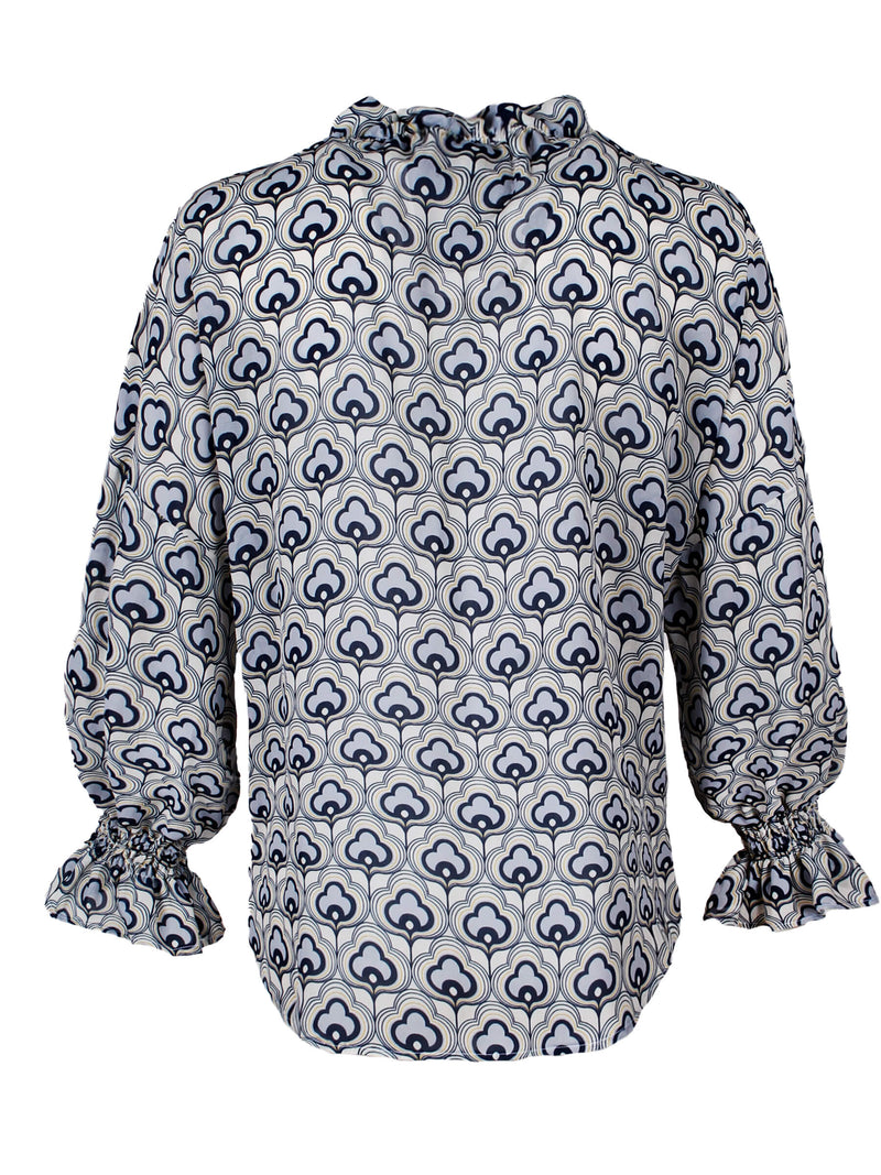 The Finley Crosby blouse, a 100% viscose button up blouse with puff sleeves, a ruffle collar, and a silver gray cloud pattern.