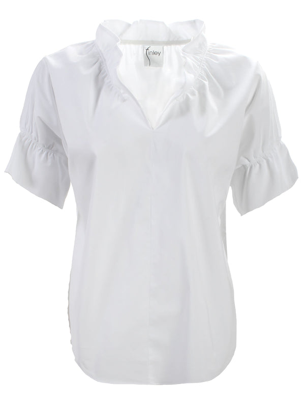 The Finley Shirts Crosby, a white short-sleeve poplin blouse with ruffle collar and sleeve detail.