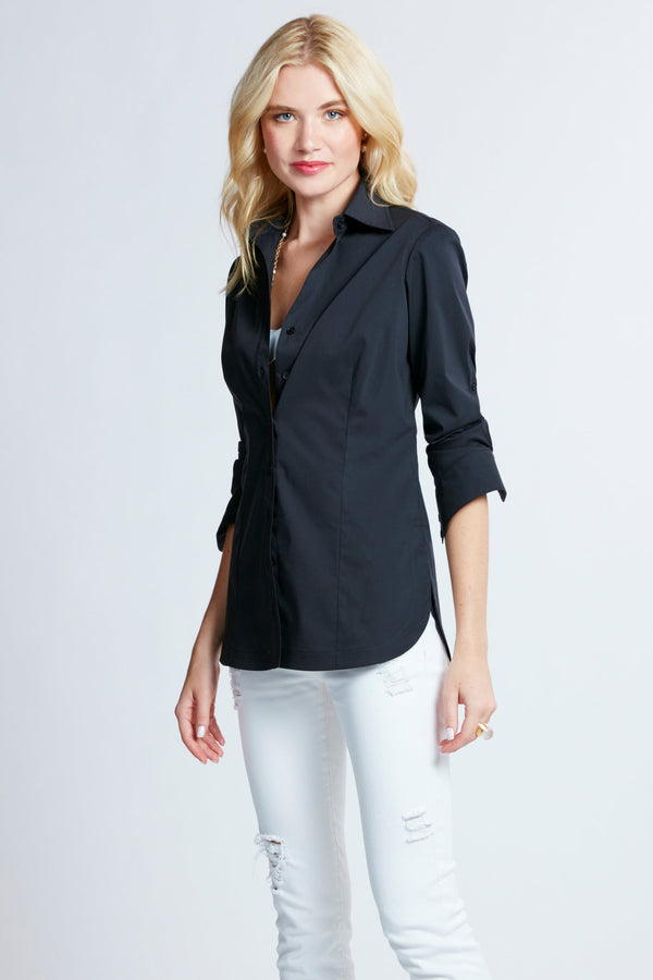 A blonde model wearing the Finley Joey blouse, a black button-down poplin shirt with a tailored fit.
