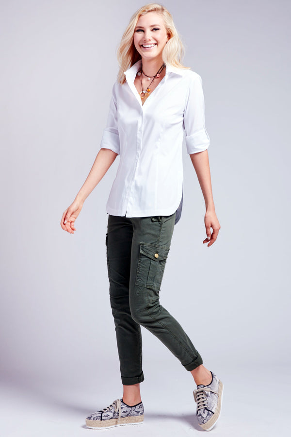 A blonde model wearing the Joey poplin, a white button-down blouse with a tailored fit and tabbed sleeves.