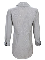 A rear view of the Finley Kaylynn tunic, a white button-down tunic style blouse with French detailing.