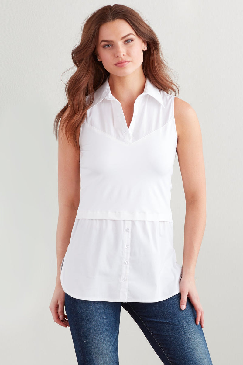 A fashion model wearing the Finley layering tank, a chambray sleeveless button-down blouse with a shirt tail hem and a knit bodice.