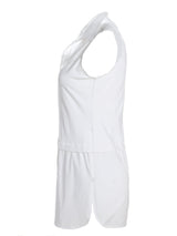 A profile view of the Finley layering tank, a white sleeveless button-down blouse with a shirt tail hem and a knit bodice.