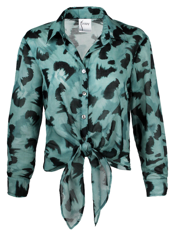The Finley Lindy shirt, a button up silk-cotton blouse with a semi-fitted shape, a tie front, and teal and black floral print.
