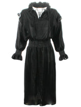A front view of the Finley Mary Jane Whisper dress, a black velvet dress with ruffle detailing and a semi-fitted shape.
