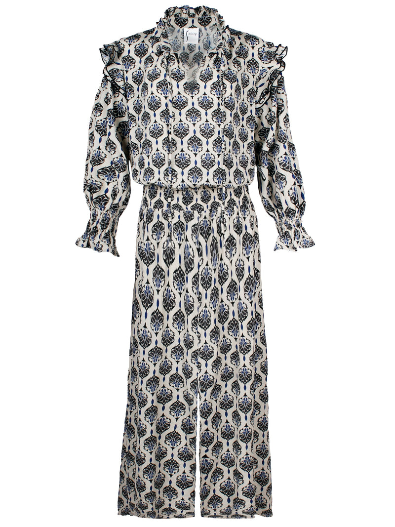 A front view of the Finley Mary Jane, a long midi dress with ruffled trim, a blouson bodice, and a vintage medallion print.