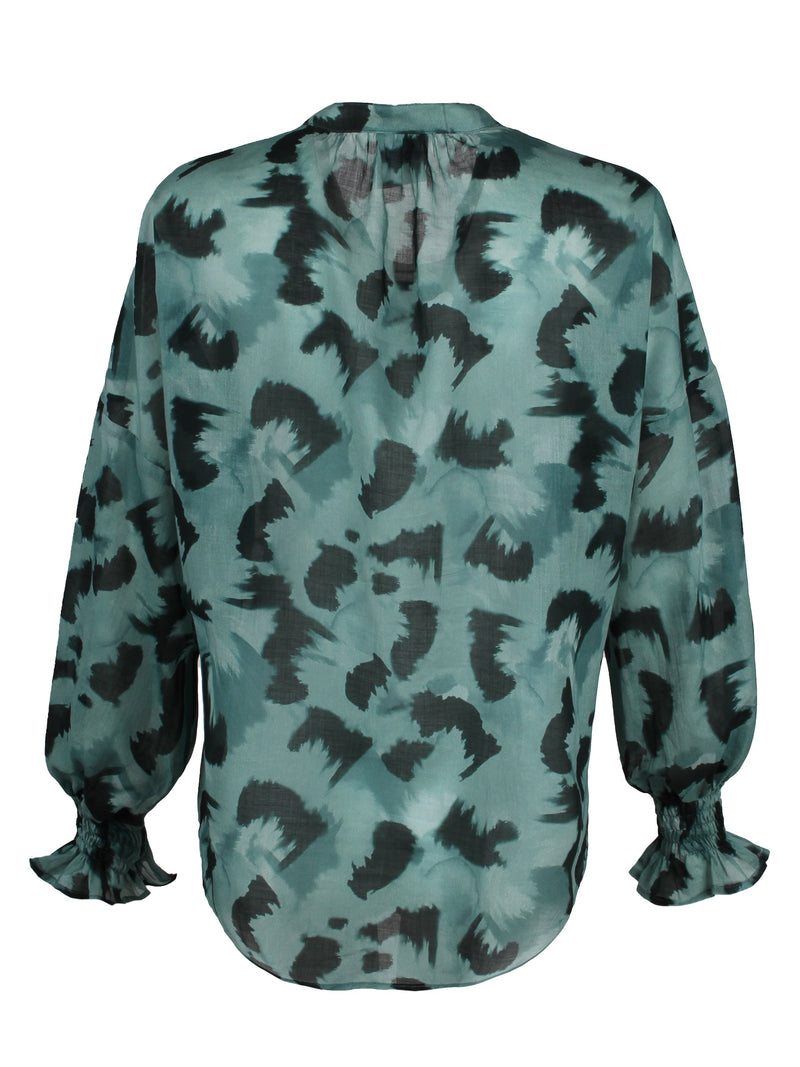 The Finley Morrisey blouse, a cotton voile pullover blouse with a drawstring mandarin collar and abstract teal black pattern.