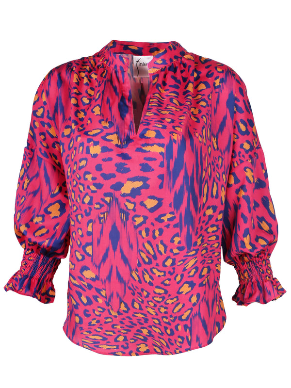 The Finley Rex blouse, a popover puff sleeve cotton shirt with a relaxed shape and a pink and purple cheetah print.