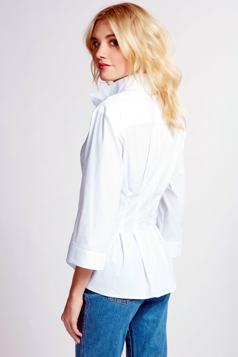The Finley Rocky blouse, a 3/4 sleeve white weathercloth button down blouse with a front tie and a fitted shape.
