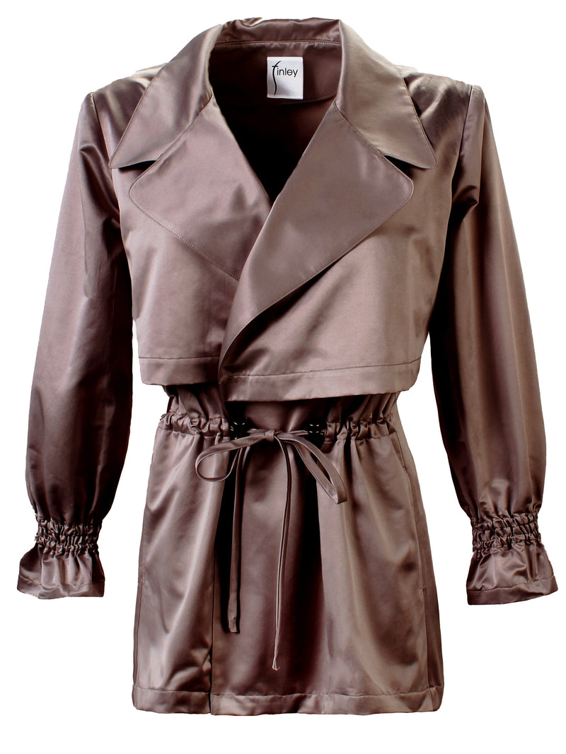 The Finley Sateen jacket, a double breasted drawstring jacket with a front tie, side seam pockets, and a pale brown color.