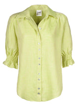 The Finley Sirena shirt, a button-down short sleeve washed linen puff sleeve blouse with a key lime green color.
