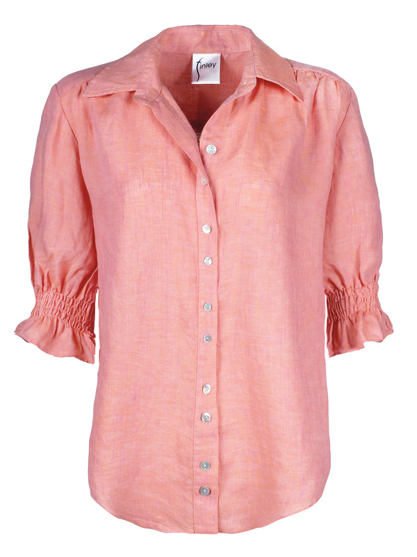 The Finley Sirena shirt, a button-down short sleeve washed linen puff sleeve blouse with a pale pink color.