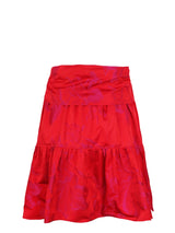 The Finley tiered skirt, a front tie midi skirt with an elastic waistband, flouce ruffle hem, and a red floral Jacquard pattern.