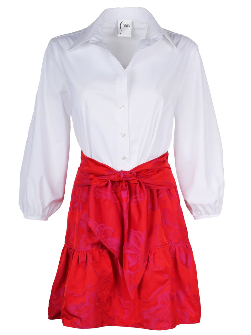 The Finley tiered skirt, a front tie midi skirt with an elastic waistband, flouce ruffle hem, and a red floral Jacquard pattern.