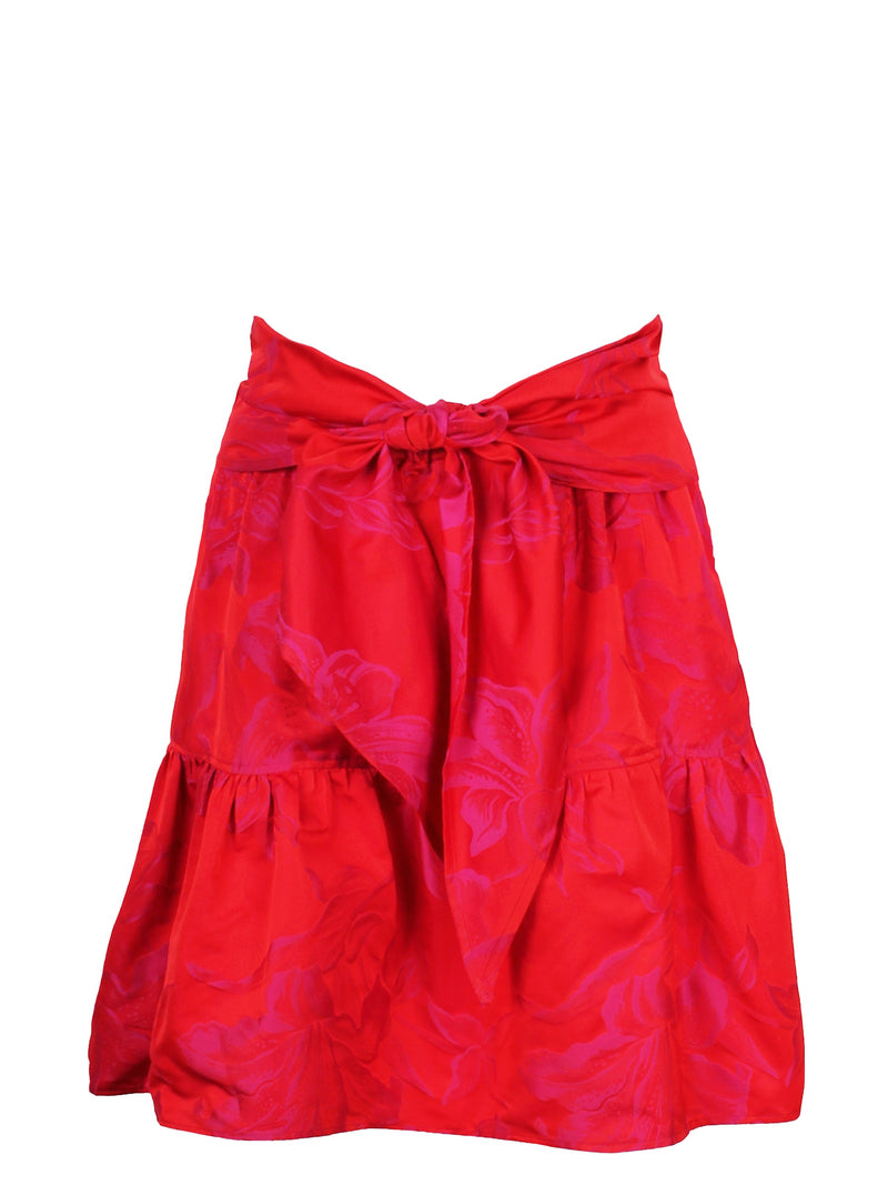 The Finley tiered skirt, a front tie midi skirt with an elastic waistband, flouce ruffle hem, and a red floral Jacquard pattern.